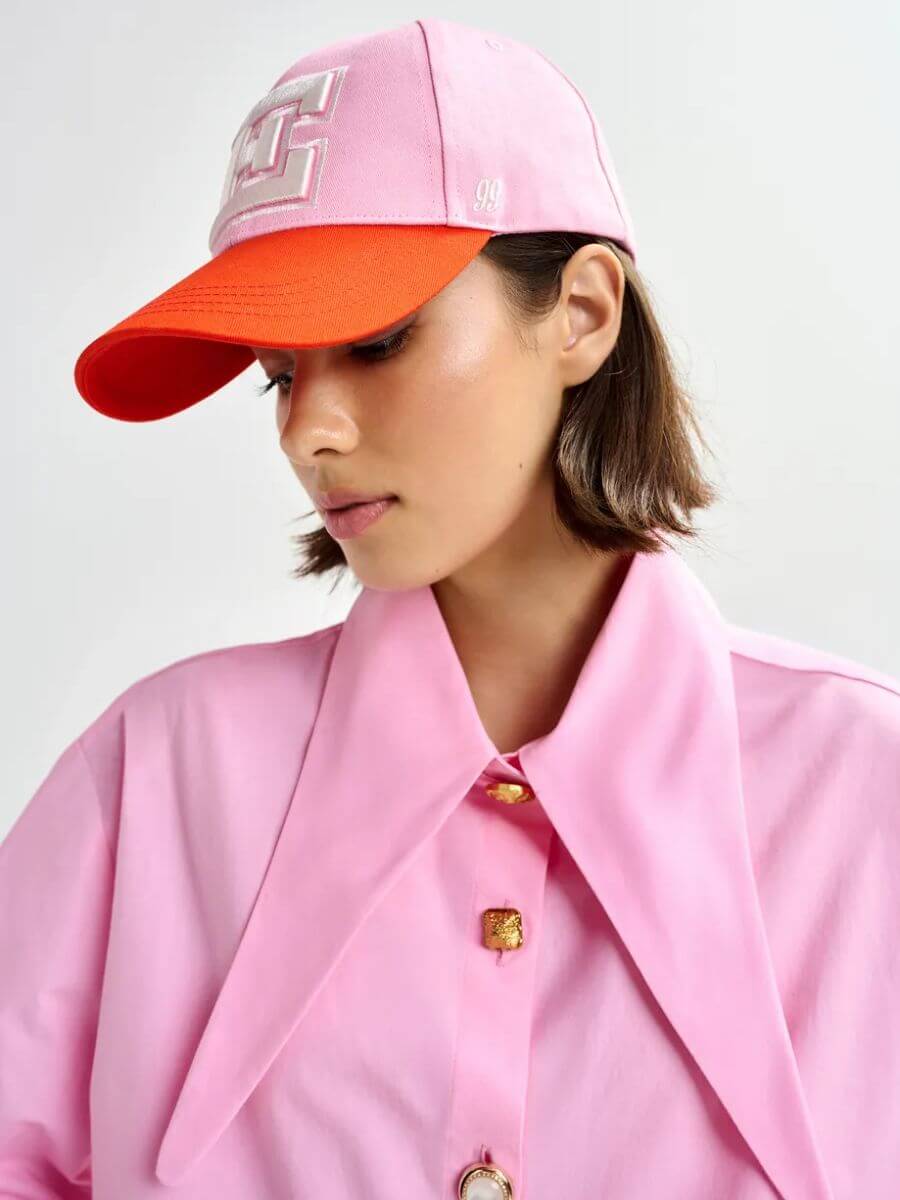 Essentiel Antwerp Jomato Shirt in Cotton Candy pink styled with pink/orange baseball cap
