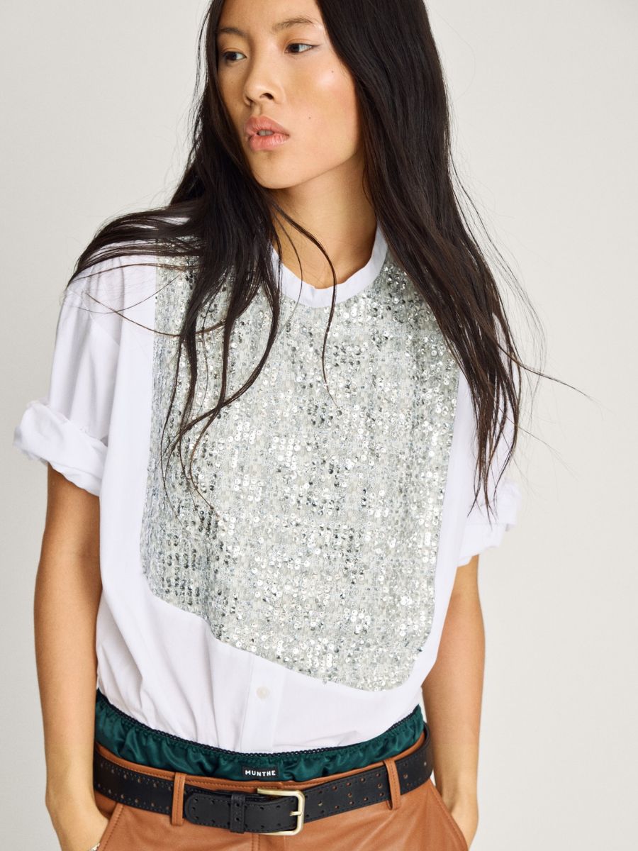 Munthe - Nayel Shirt - White Mix styled with sleeves rolled up to short sleeves, tucked into layered satin green skirt and brown leather skirt with black belt