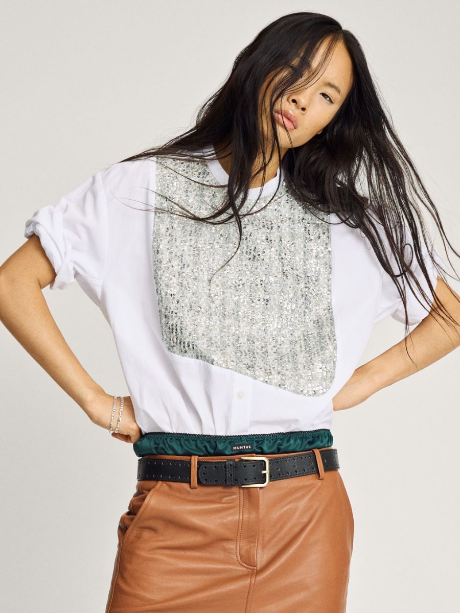 Munthe - Nayel Shirt - White Mix styled with sleeves rolled up to short sleeves, tucked into layered satin green skirt and brown leather skirt with black belt