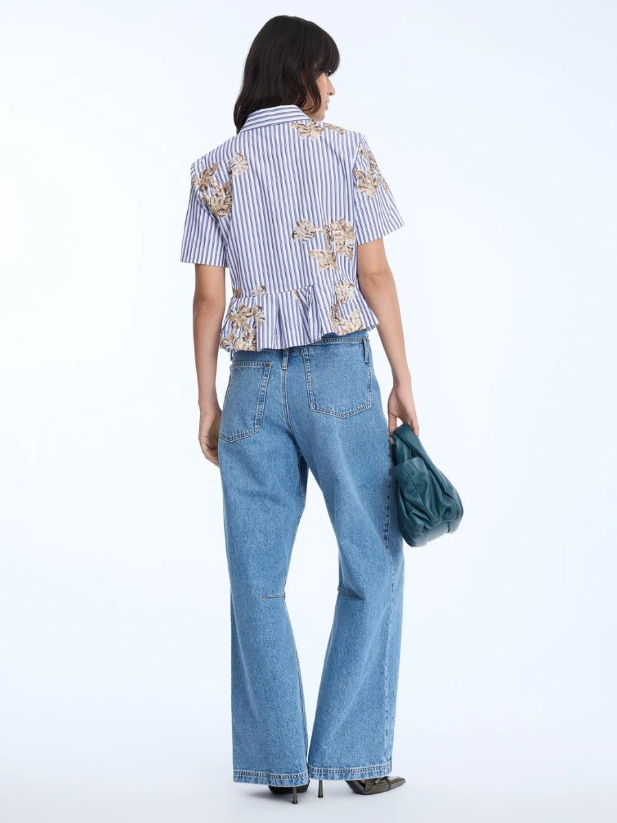Munthe - Nuriana Top - Stripe White styled with light blue wide leg jeans, petrol blue leather slouchy handbag and pointed toe kitten heels back view