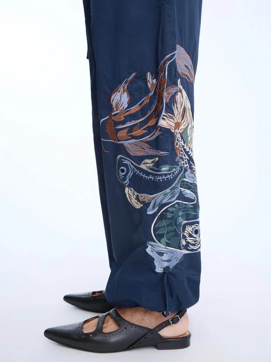 Munthe - Unform Pants - Navy side view zoom on embroidery detail - light blue, brown, cream, sage colour details