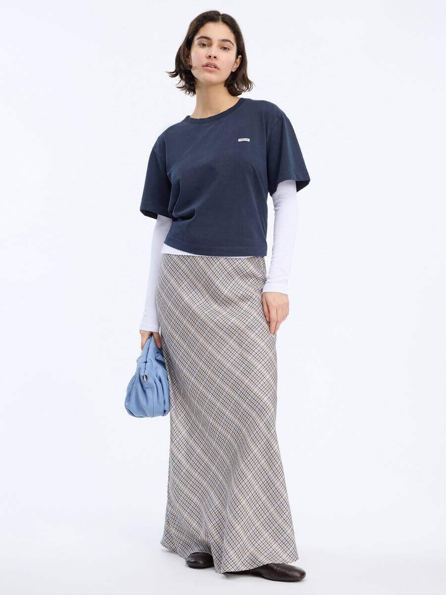 Munthe Bardot Skirt styled with leather flats and layered long and short sleeve tees in navy and white with light blue leather clutch bag