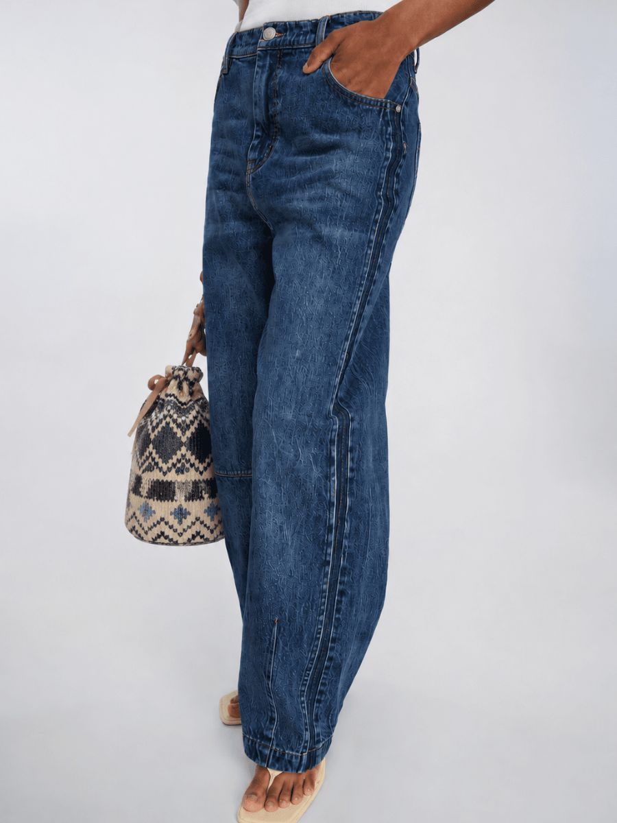Munthe Bohdi Jeans paired with flip flops, white tee and sequin pouch bag