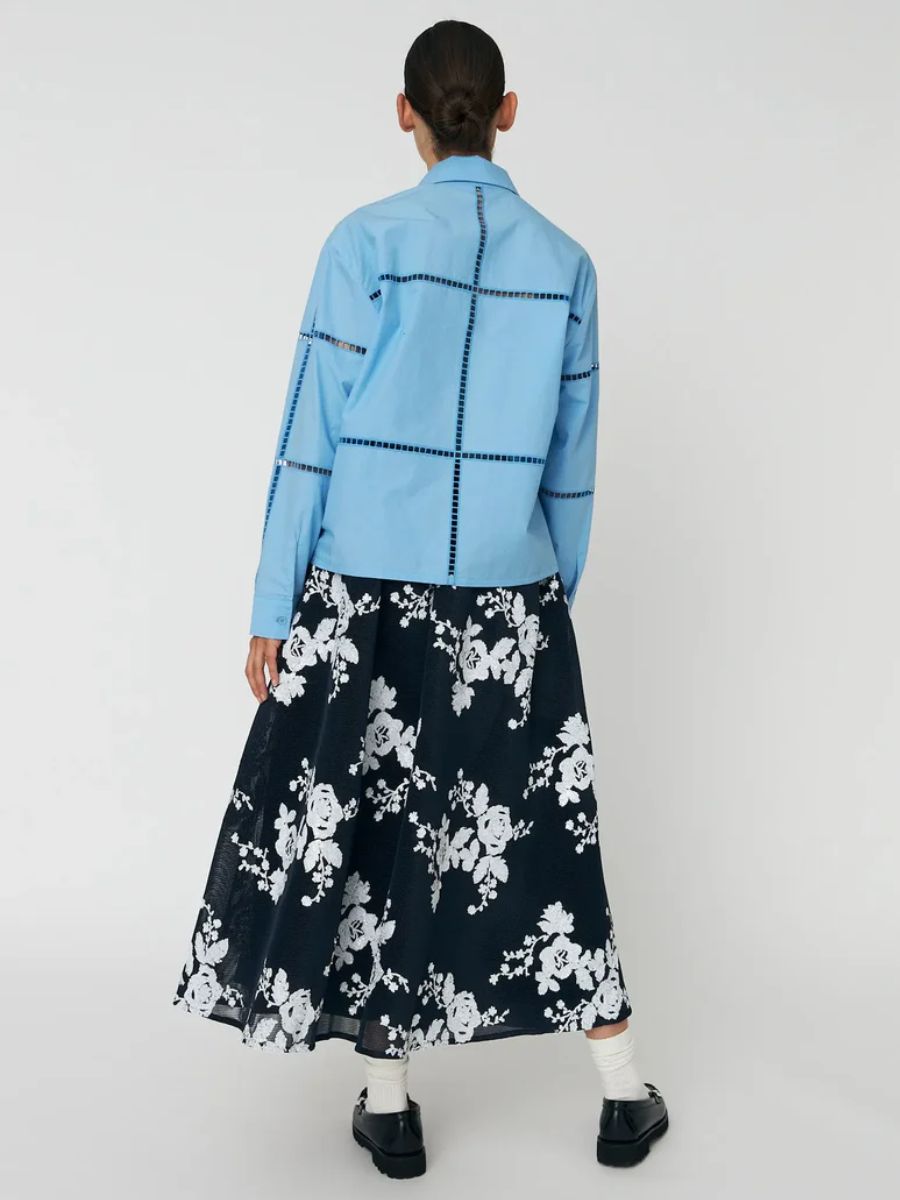 Stella Nova - Wide Shirt with Artworks - Blue Coral styled with black floaty midi skirt with white floral pattern, black/white loafers and white ankle socks