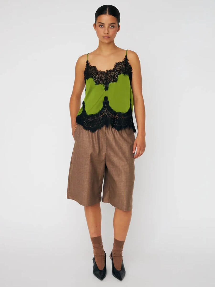 Stella Nova Delicate Lace Top - Green Flash styled with brown tailored shorts, brown ankle socks and black sling back kitten heels