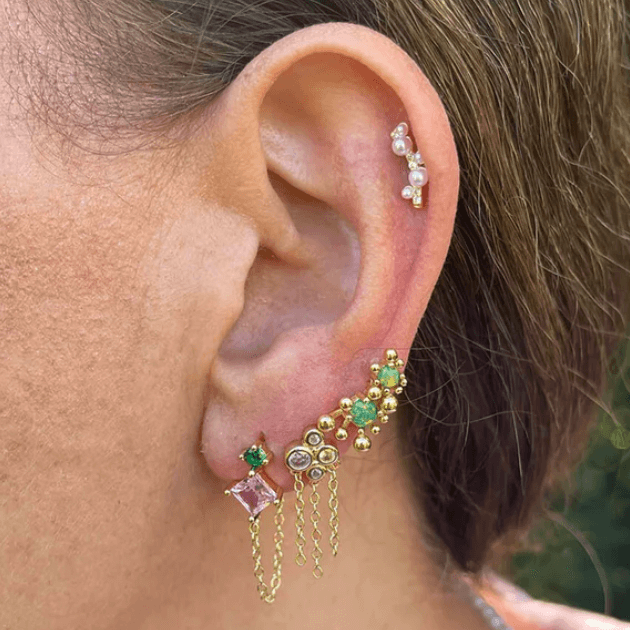 Nuni earrings stacked up ear