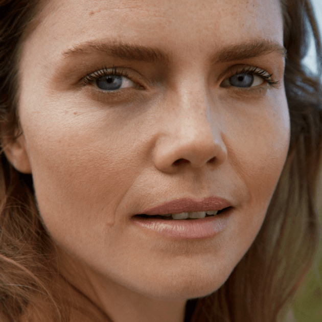 Close up of models face wearing subtle, barely there make-up by Kjaer Weiss