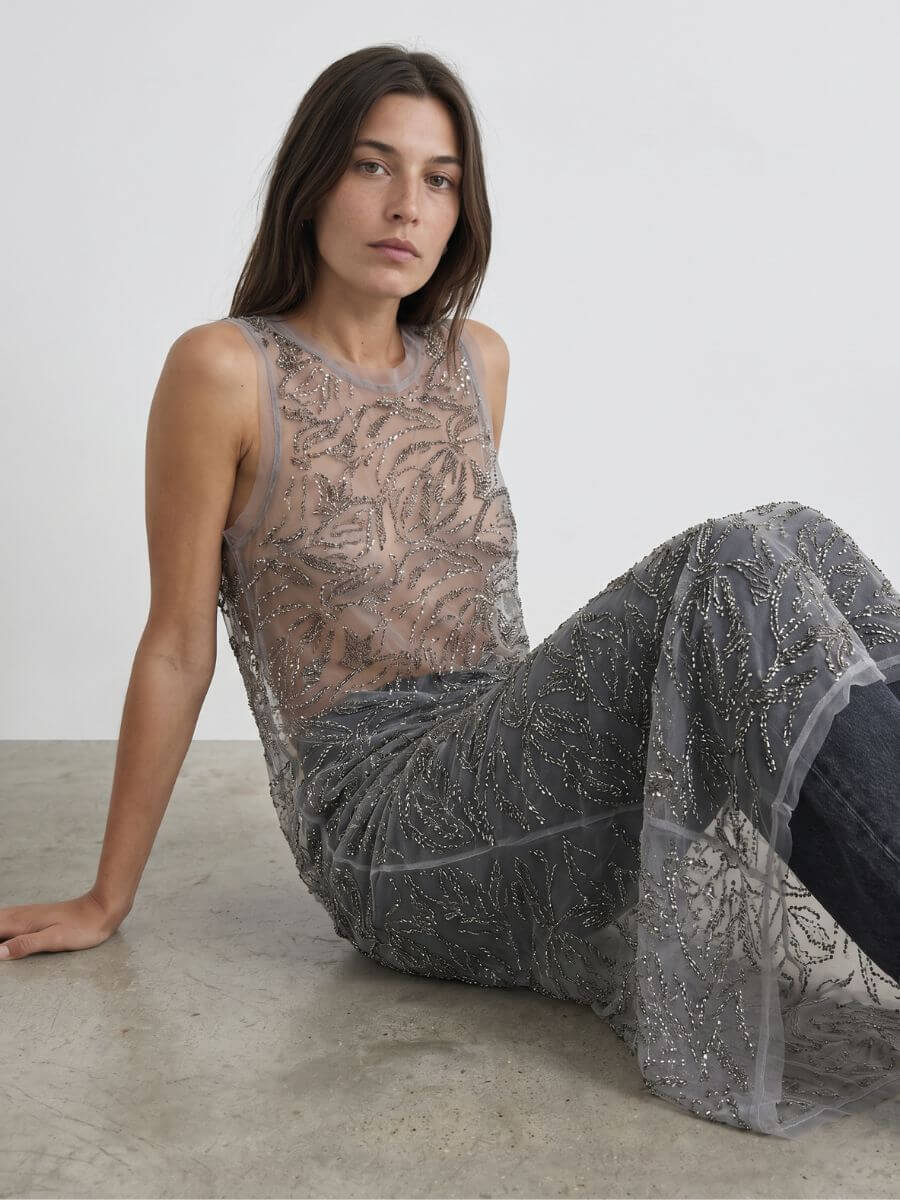 MUNTHE Varika Dress worn over grey wide leg jeans with heels and embossed leather handbag