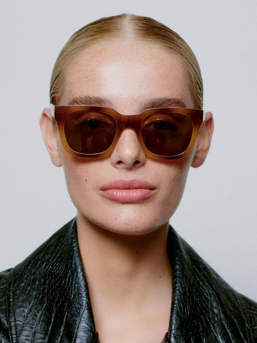 A.Kjaerbede Nancy Sunglasses in Demi Brown worn by model with slicked back bun and leather blazer
