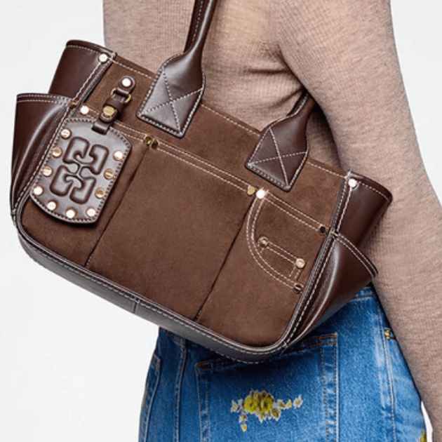 Ganni Posy brown suede and leather shoulder Bag with sand sweater and embroidered denim
