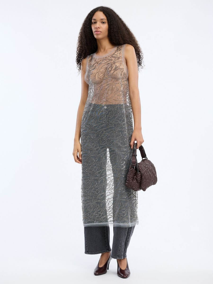 MUNTHE Varika Dress worn over grey wide leg jeans with heels and embossed leather handbag