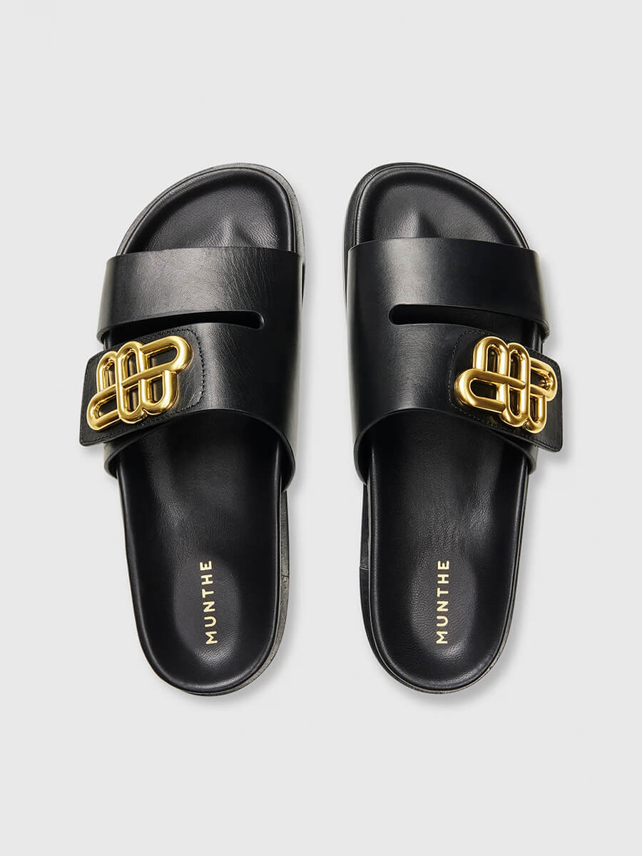 Munthe-Ombrillia-Sliders - Black sliders with gold buckle detail