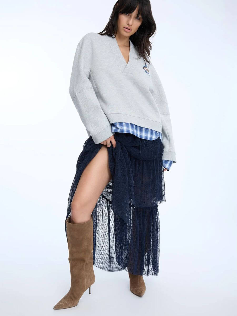 Munthe - Nessarose Skirt - Navy styled with blue checked shirt, grey sweatshirt with blue motif and brown knee high suede boots