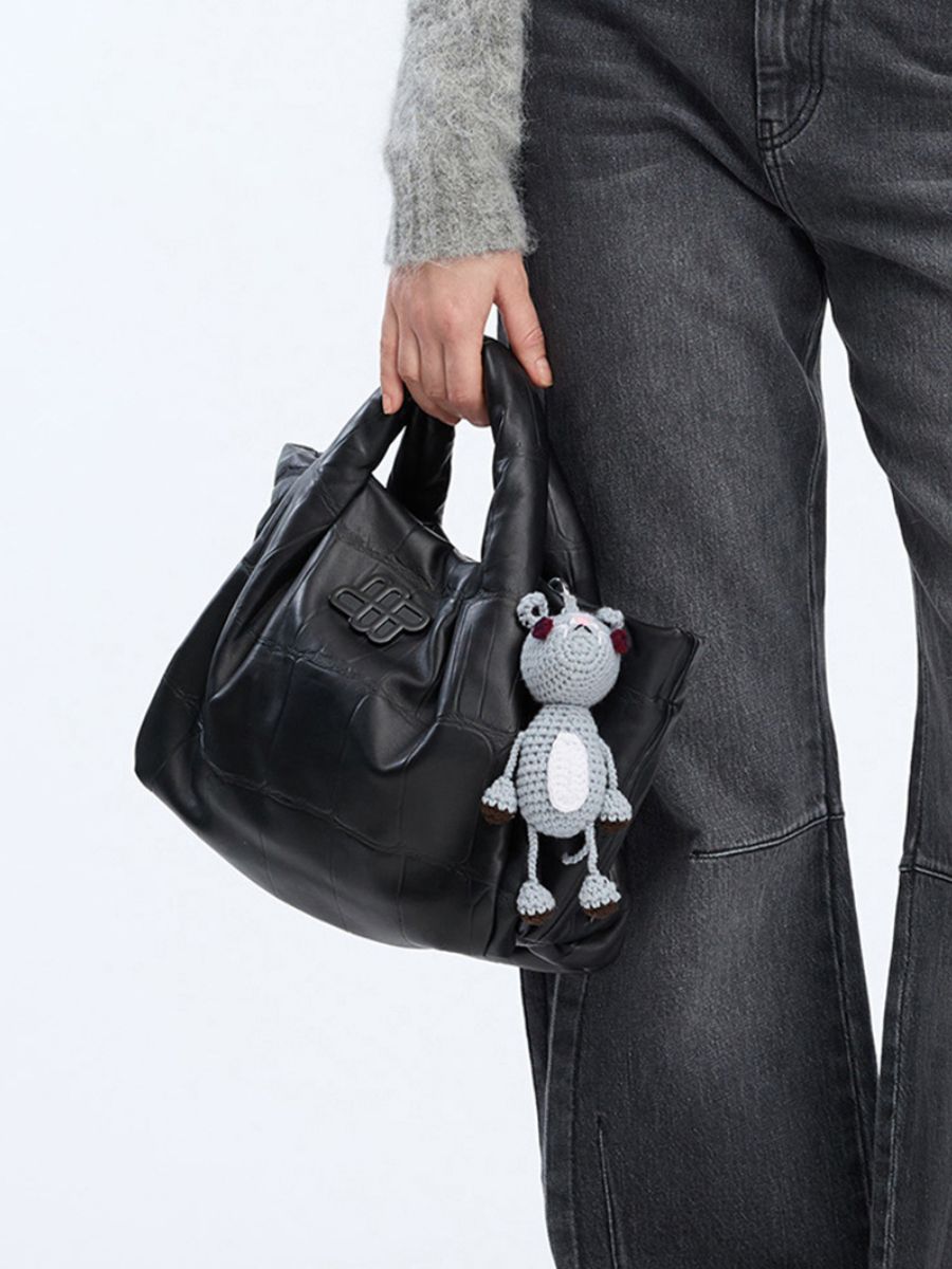 Munthe - Vamke Bag Charm on black leather bag with dark grey wide leg jeans and soft light grey knit