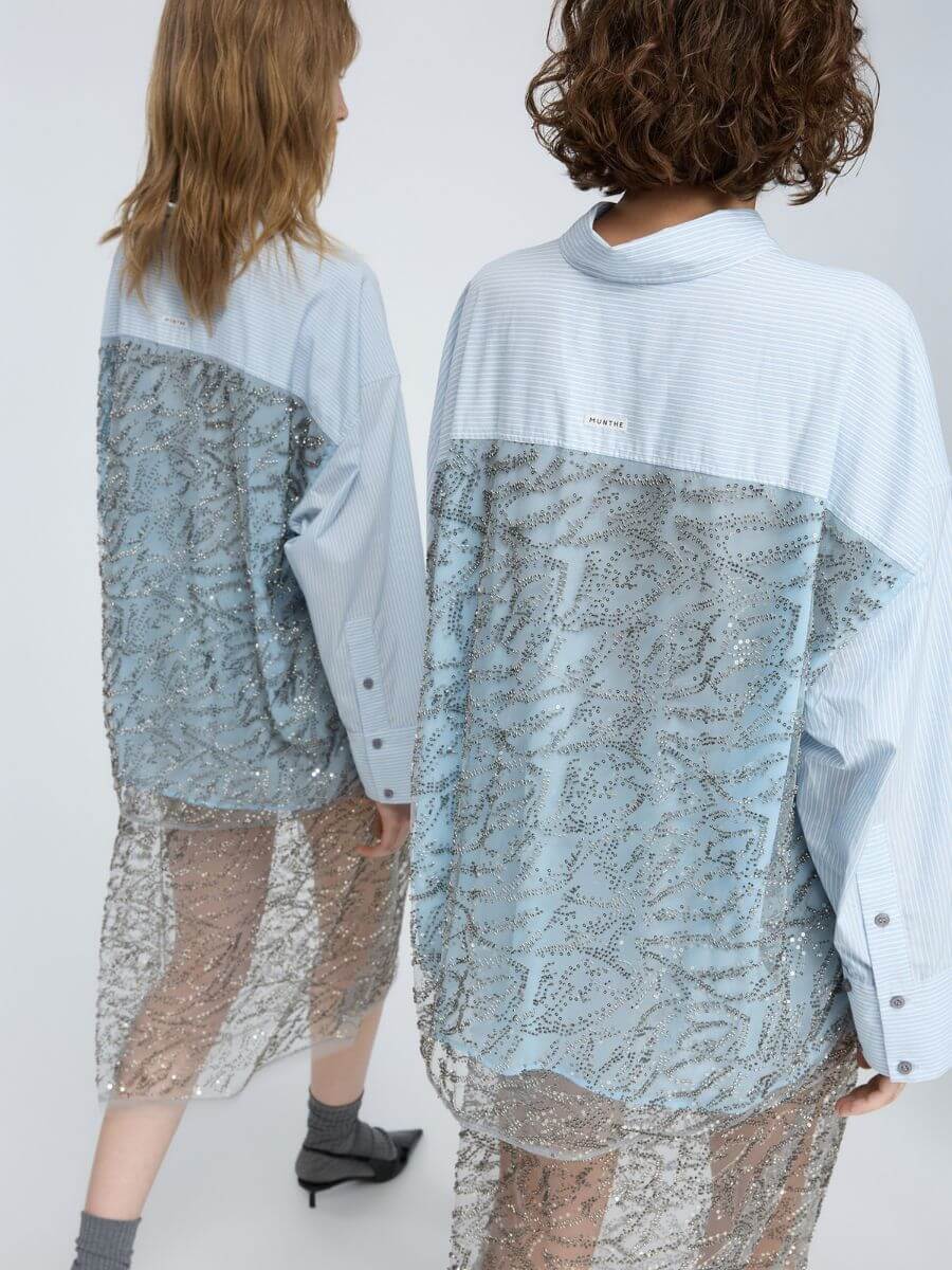 Munthe - Vontario Shirt - Stripe Blue worn over glitter skirt with grey socks and black pointed slingback heels back view