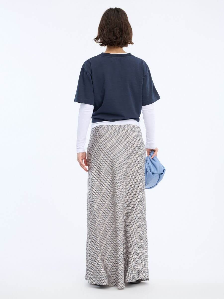 Munthe Bardot Skirt styled with leather flats and layered long and short sleeve tees in navy and white with light blue leather clutch bag - back view