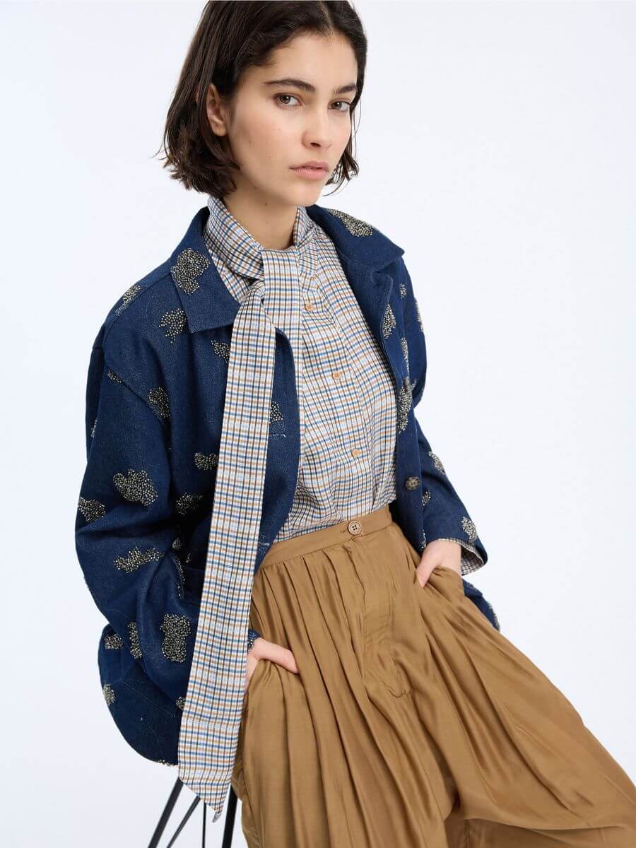 Munthe Veiling Shirt styled with denim jacket, tie left loose and camel brown pleated trousers
