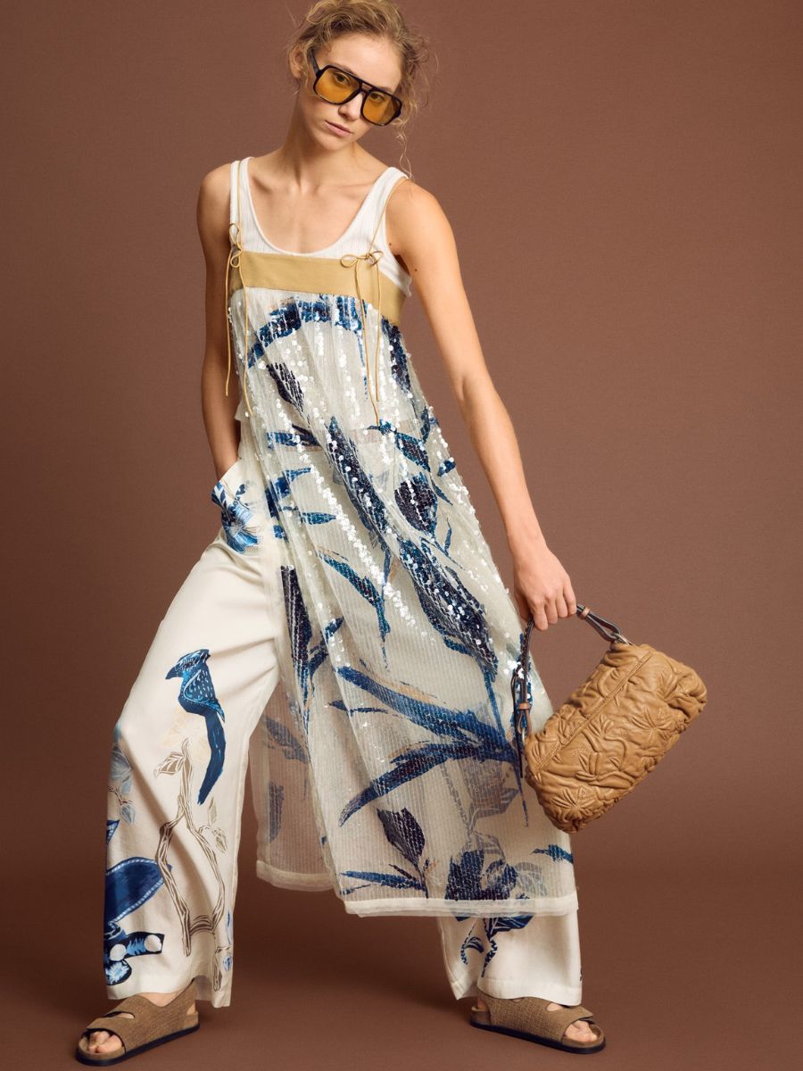 Munthe - Nara Dress - Print Kit styled over wide leg cream printed trousers, white vest top, brown suede chunky sandals and brown leather handbag with oversized aviator sunglasses