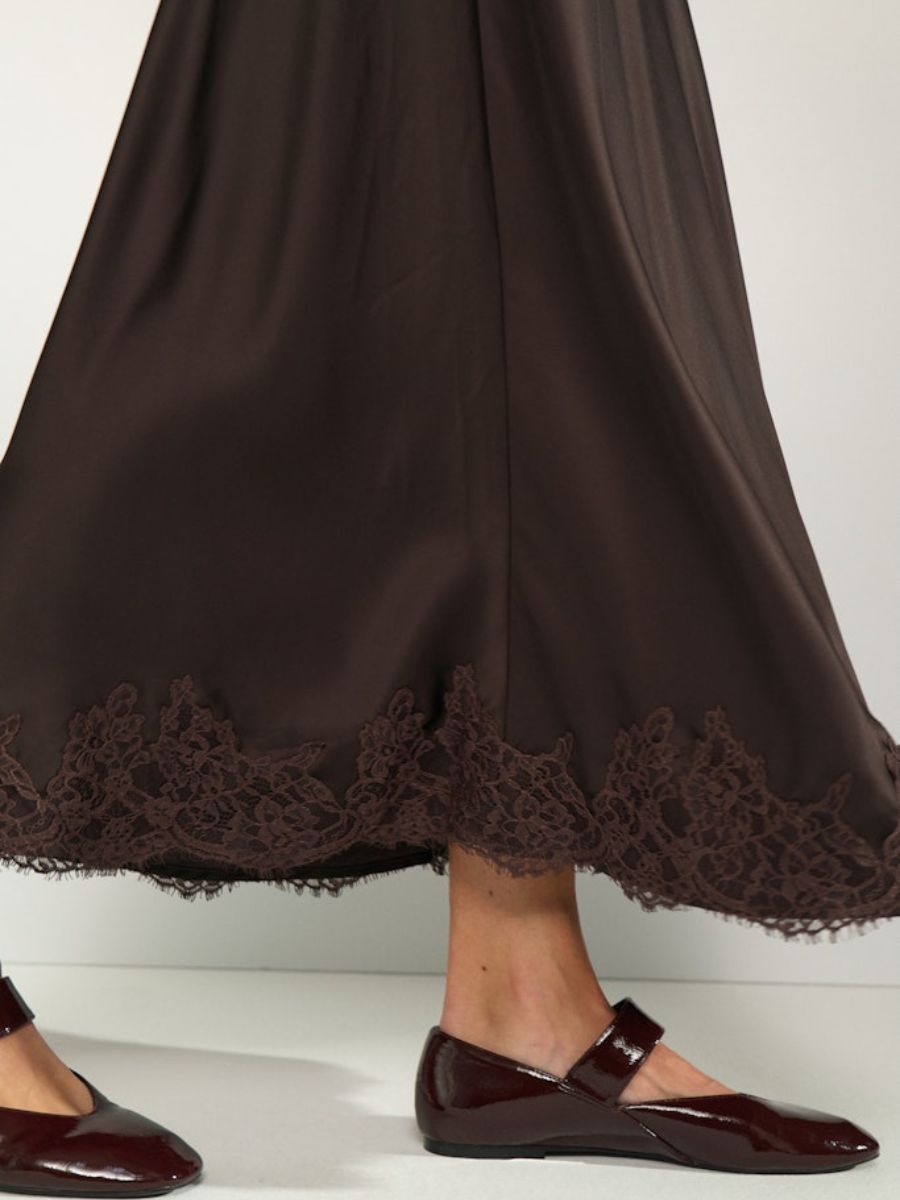 Numph - Nadine Skirt side view as model walks showcasing the drape and movement of the skirt