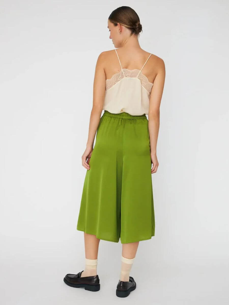 Stella Nova - Delicate Shorts - Green Flash styled with Delicate Lace Top in cream, black loafers and cream ankle socks back view