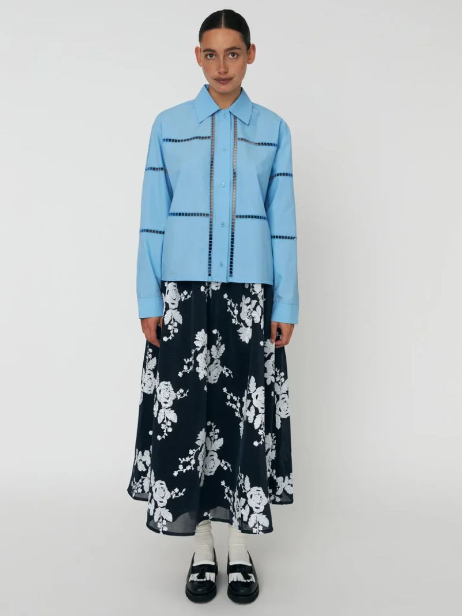 Stella Nova - Wide Shirt with Artworks - Blue Coral styled with black floaty midi skirt with white floral pattern, black/white loafers and white ankle socks