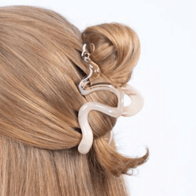 Sui Ava New Sketch Big Hair Clip holding model's hair in half up half down style