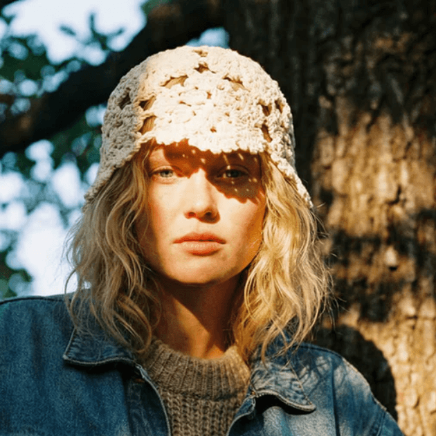 Black Colour Roseanne Crotchet Hat on model in front of a tree in golden hour